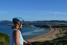 cyclist admiring la lanzada beach