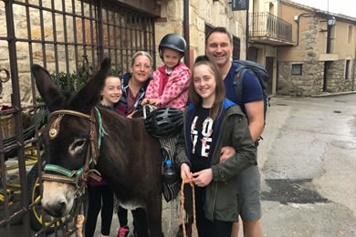 family enjoying their donkey trek